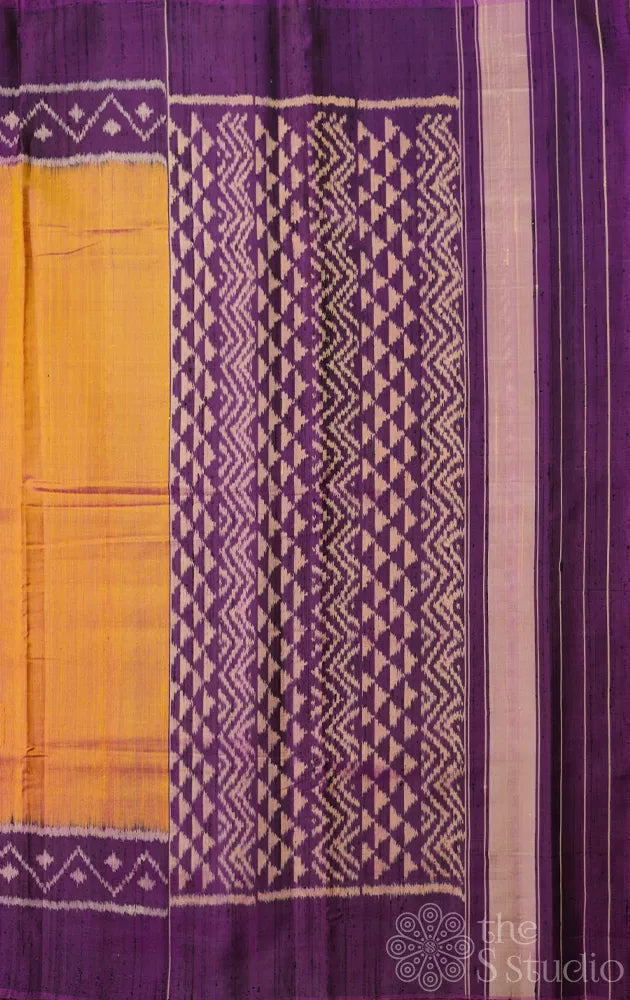 Light peach patola raw silk saree with purple border