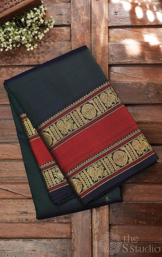 Peacock green kanchi silk saree with rettaipet border and kili motifs pallu