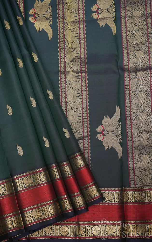 Peacock green kanchi silk saree with rettaipet border and kili motifs pallu
