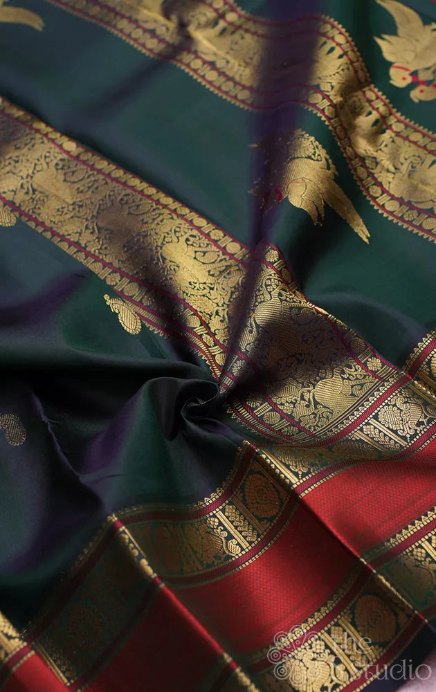 Peacock green kanchi silk saree with rettaipet border and kili motifs pallu