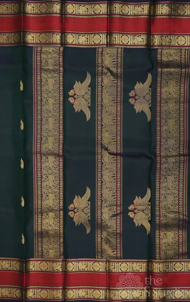 Peacock green kanchi silk saree with rettaipet border and kili motifs pallu