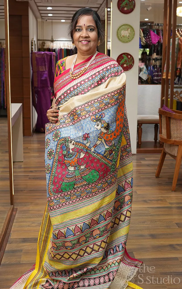 Beige vidharbha tussar silk saree with rani pink and yellow ganga jamuna border and madhubani hand painting