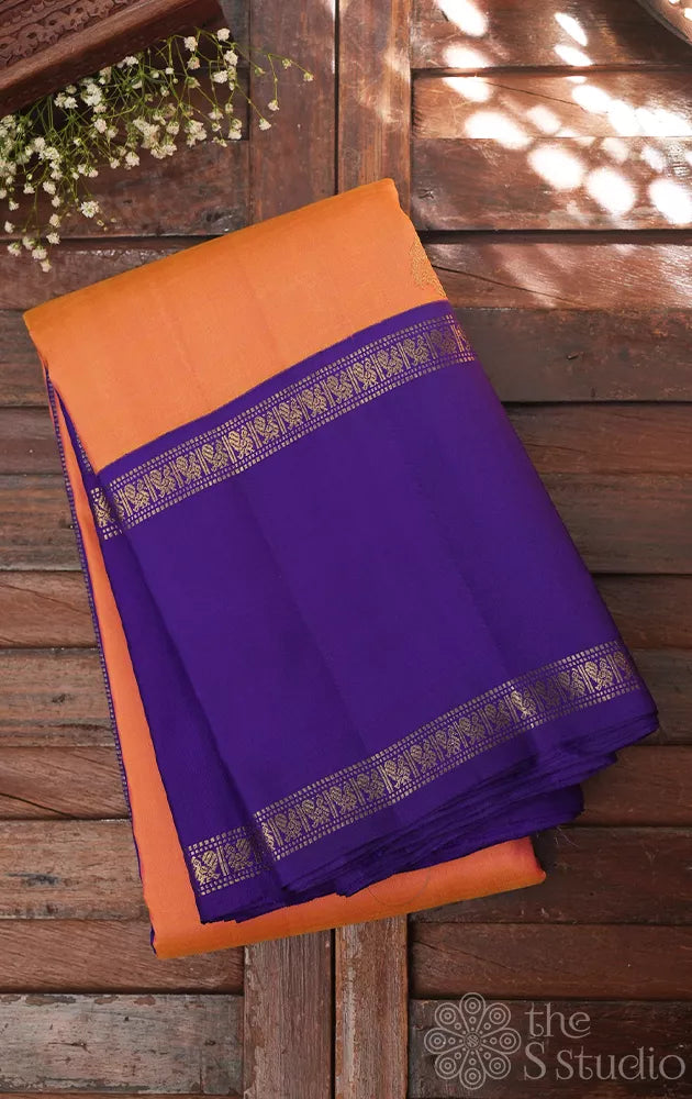 Light orange kanjivaram silk saree with korvai violet border