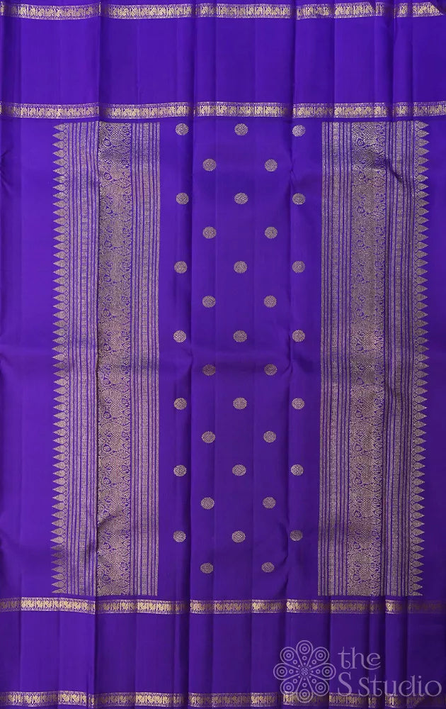 Light orange kanjivaram silk saree with korvai violet border