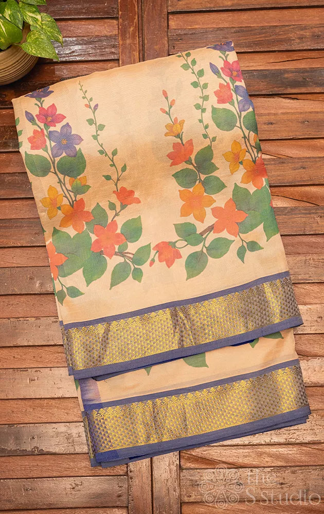 Beige floral printed silk cotton saree with zari border