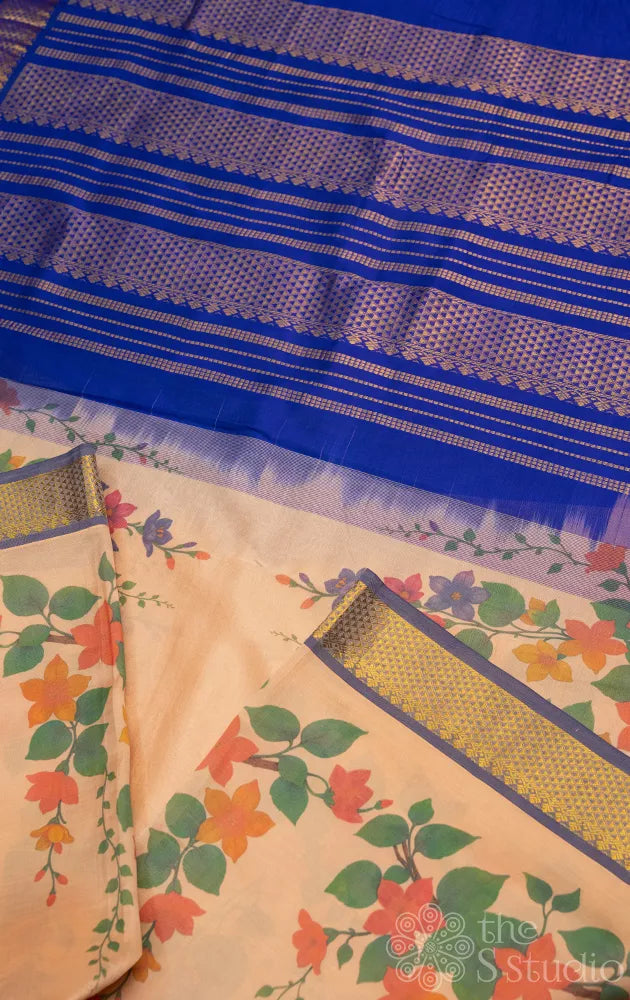 Beige floral printed silk cotton saree with zari border