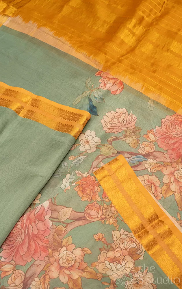 Teal green printed silk cotton saree with mustard rettaipet border