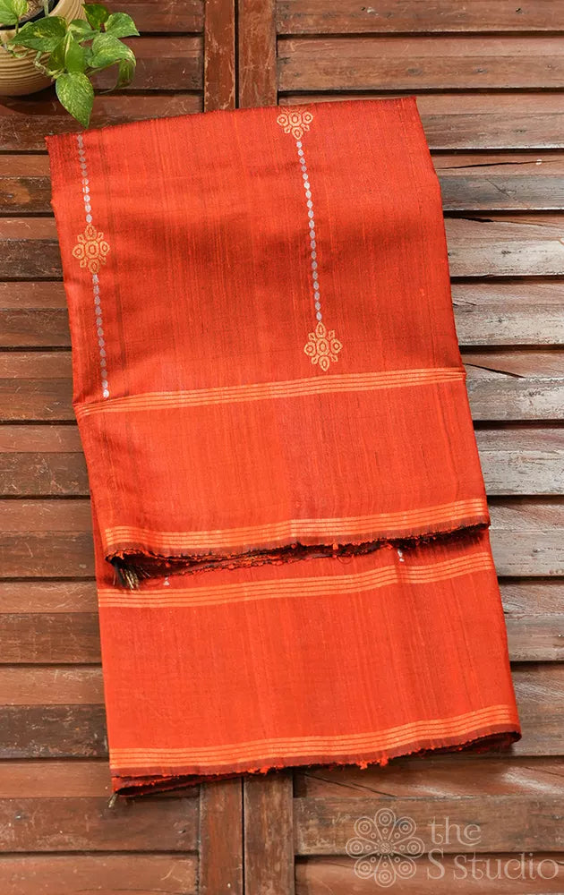 Orange raw silk saree with zari buttas