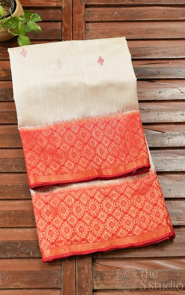 Off white raw silk saree with red zari border