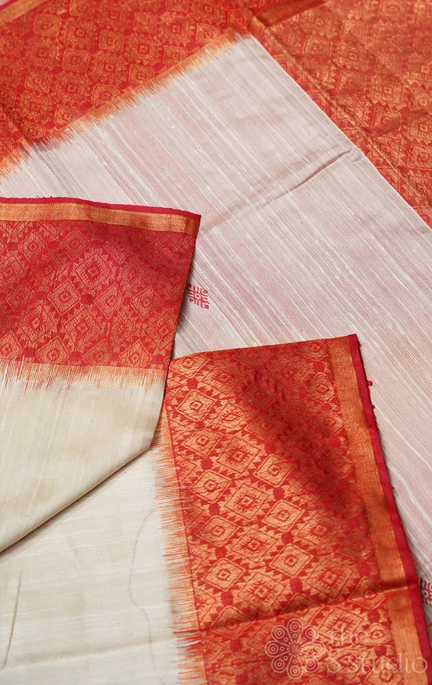 Off white raw silk saree with red zari border