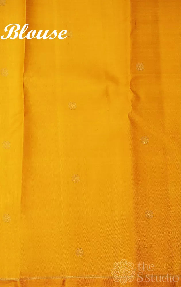 Purple kanchipuram silk saree with kolam buttas and double pallu