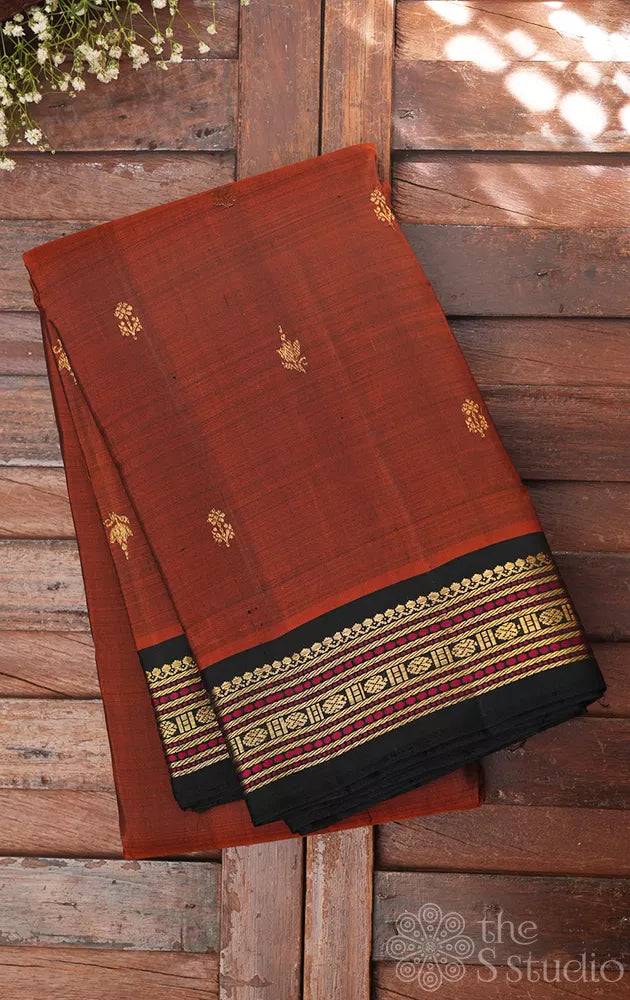 Rust kanjeevaram silk saree with small black meenakari border 