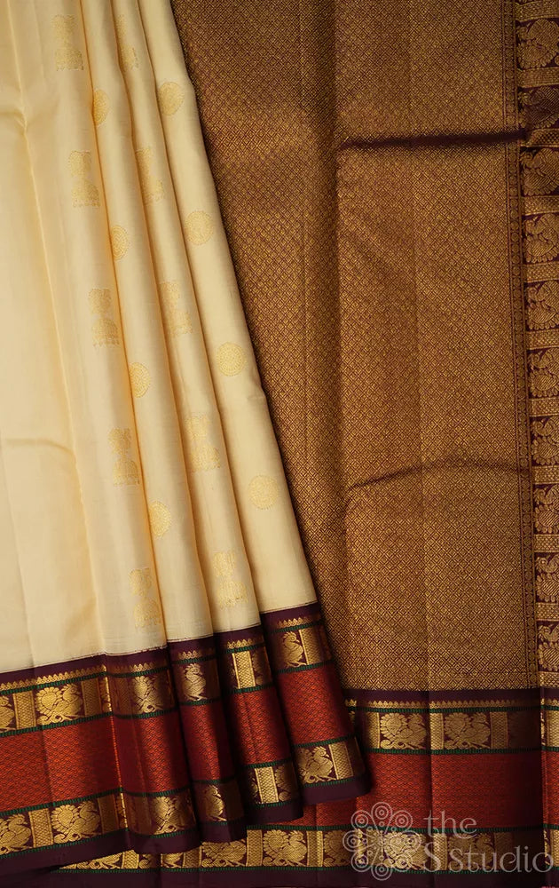 Cream kanjivaram silk saree with brown korvai rettaipet border