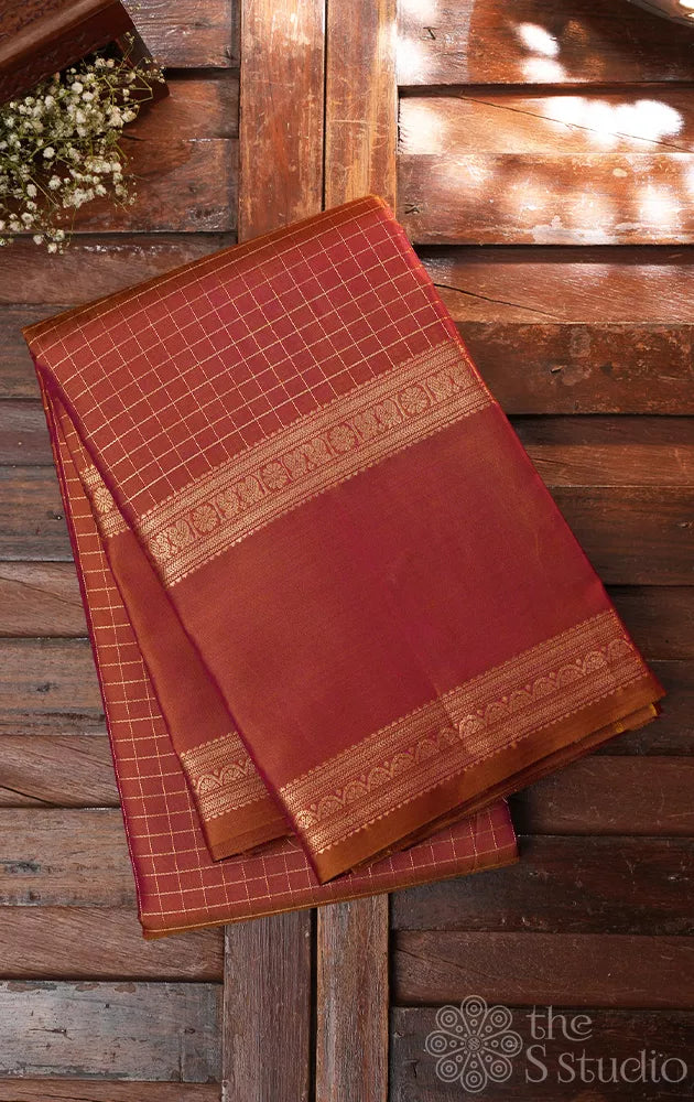 Peachish mustard kanjivaram silk saree with zari checks and rettaipet border