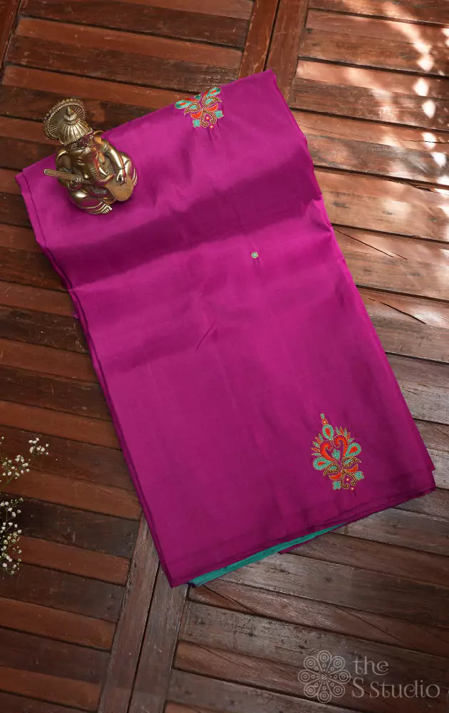 Purple hand embroidered kanchi silk saree with sea green pallu