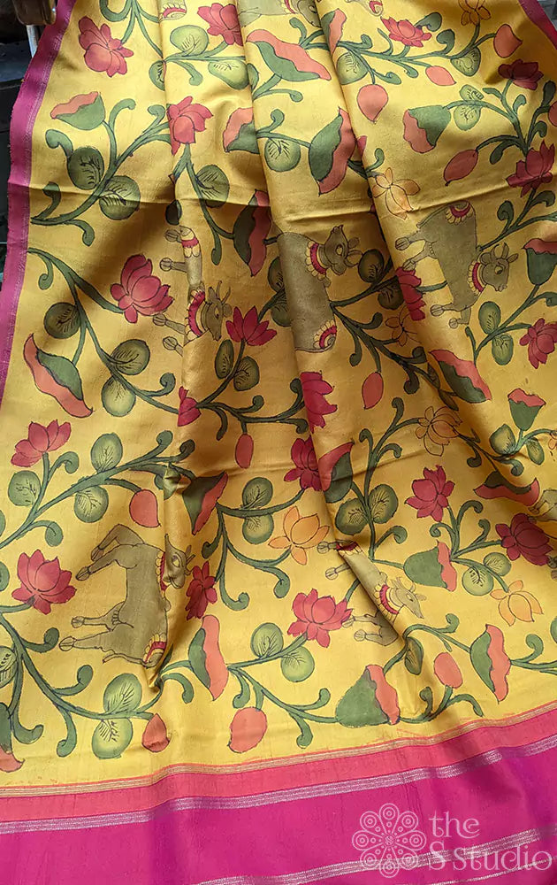 Yellow kanchipuram silk saree with kalamkari hand painting and a contrast rani pink pallu