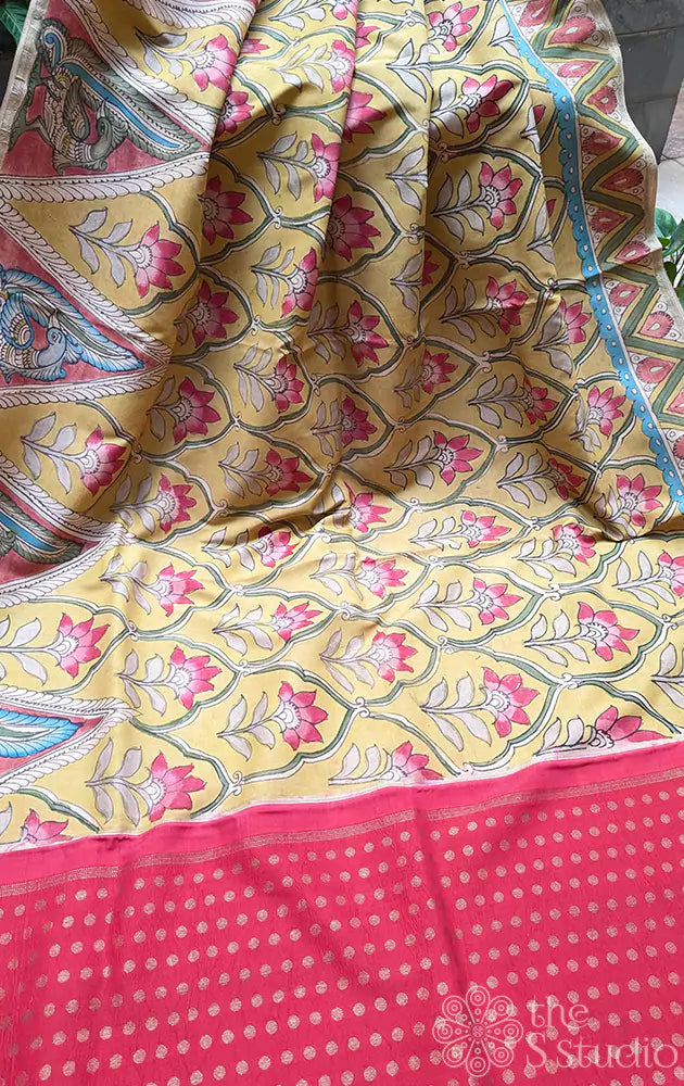 Yellow hand painted kanchi kalamkari saree with a contrast maroon pallu and butta blouse