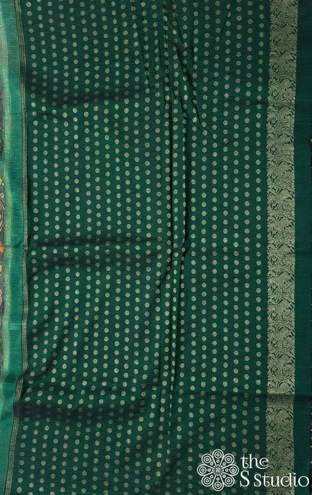 Off white hand painted kalamkari on a kanchipuram silk saree with contrast green pallu and butta blouse