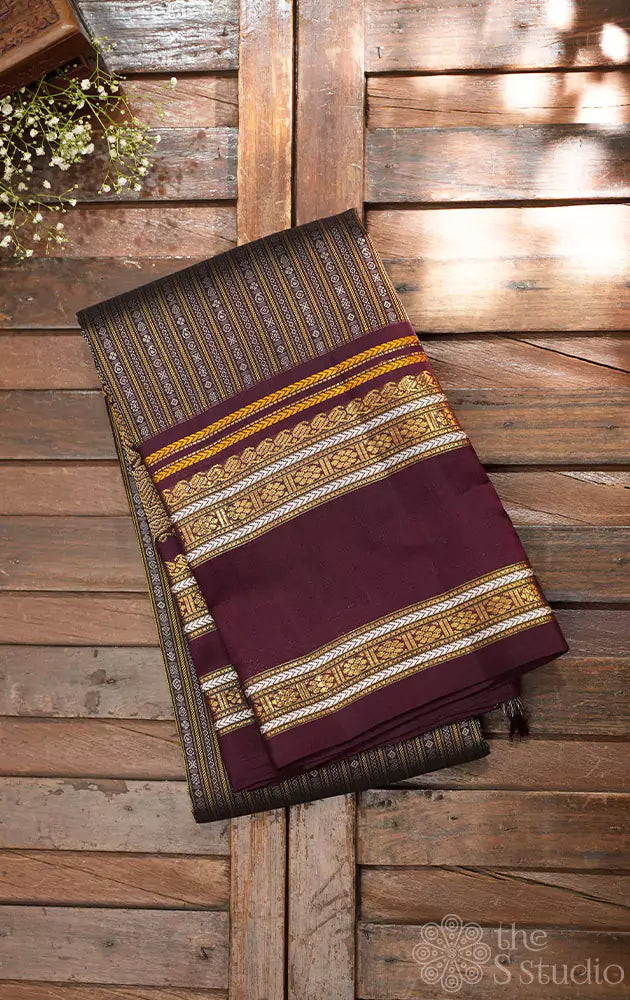 Deep brown kanjivaram saree with thread woven body and a zari rich border