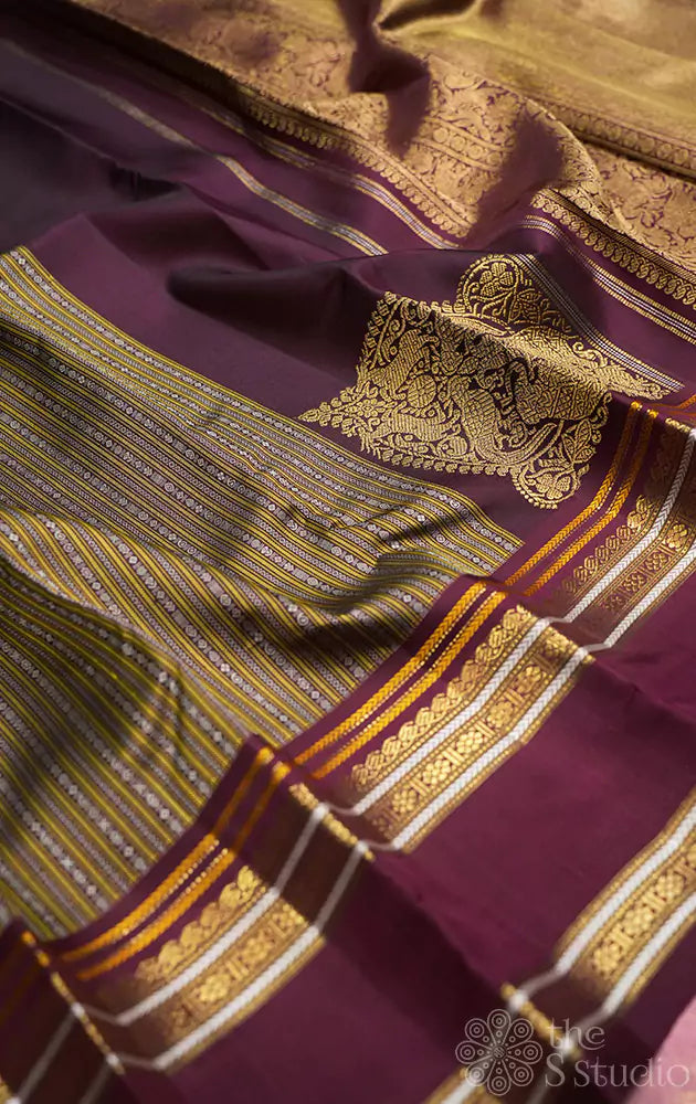 Deep brown kanjivaram saree with thread woven body and a zari rich border