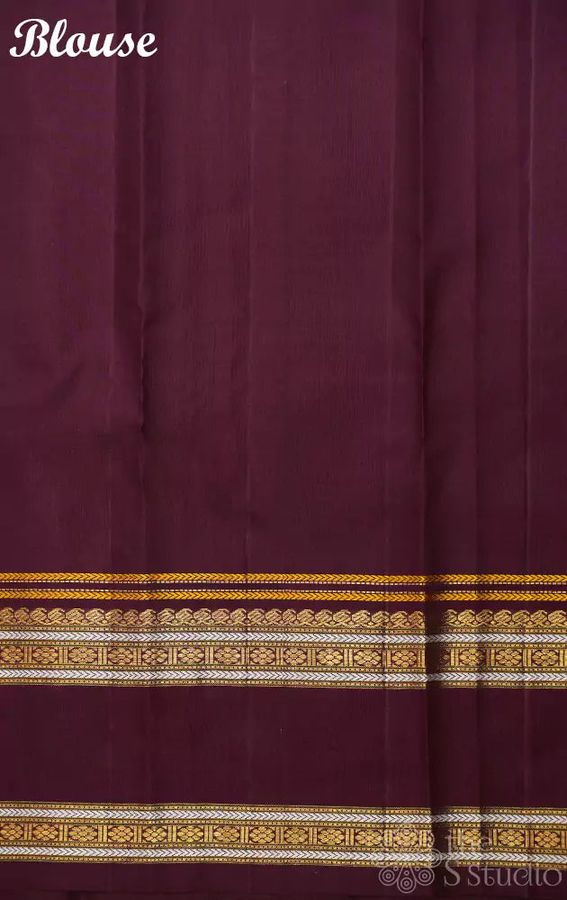 Deep brown kanjivaram saree with thread woven body and a zari rich border