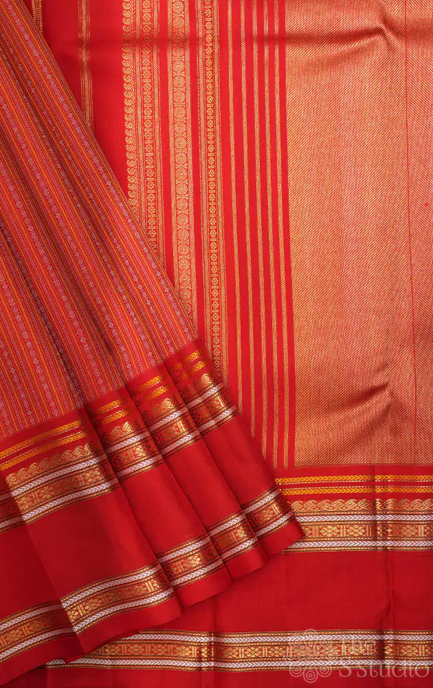 Red kanjivaram saree with thread woven body and a zari rich border