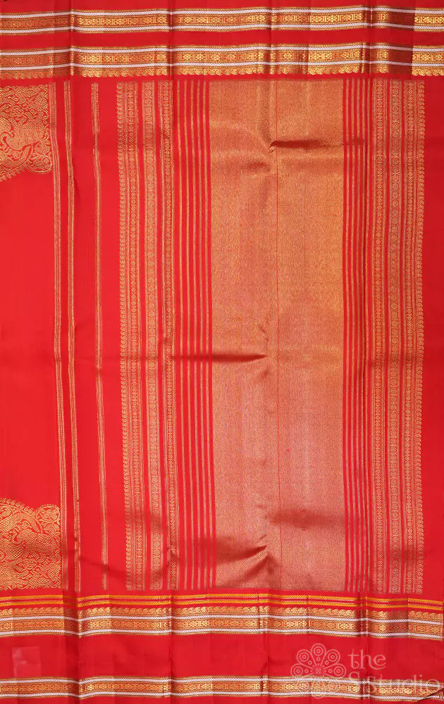 Red kanjivaram saree with thread woven body and a zari rich border