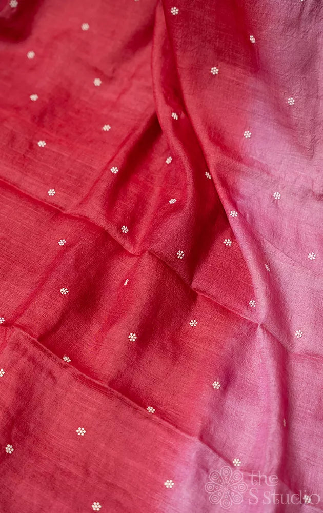 Maroon shaded tussar silk saree with white floral embroidery and scallop border