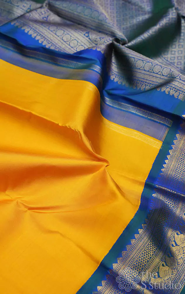 Mustard yellow kanjivaram saree with korvai border