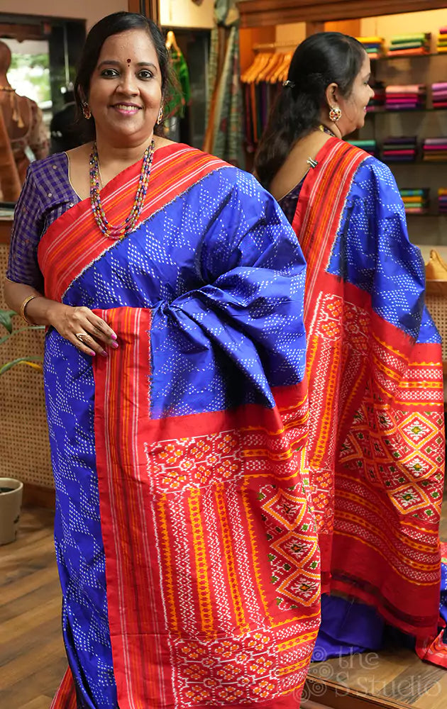 Royal blue twill ikkat silk saree with red border