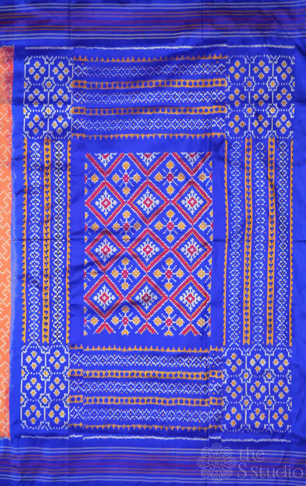 Peach twill ikkat silk saree with blue border