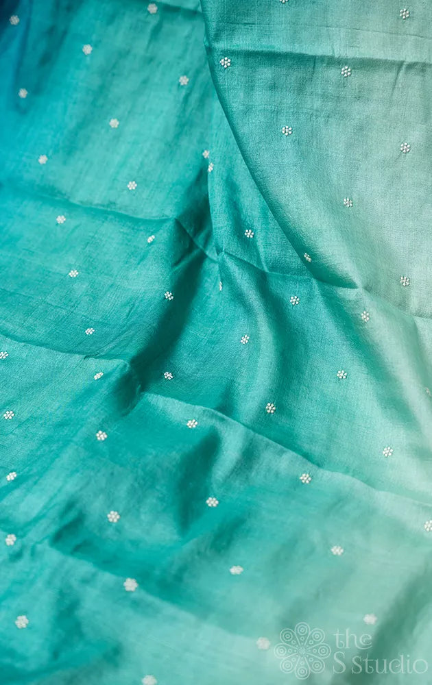 Shades of blue tussar silk saree with white embroidery and scallop border