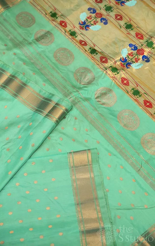 Sea green colour gadwal silk saree with zari buttas