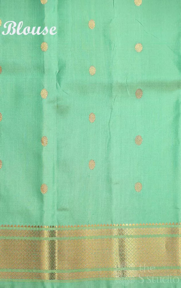 Sea green colour gadwal silk saree with zari buttas