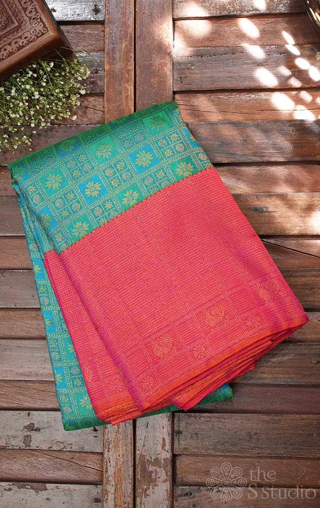 Aqua blue and pastel green kanchi pattu saree with peach big border