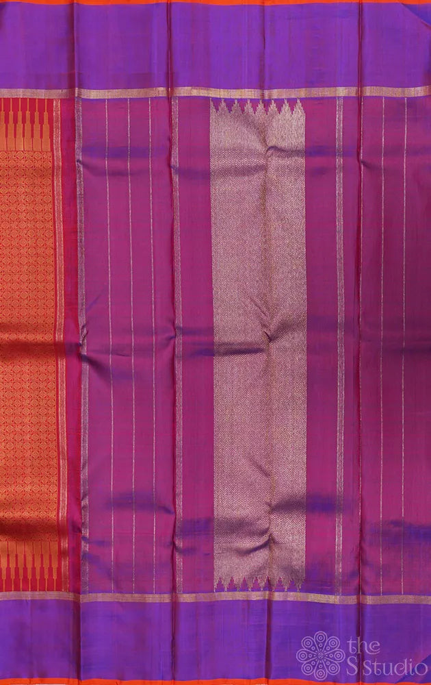 Reddish orange kanchi silk saree with a purple border