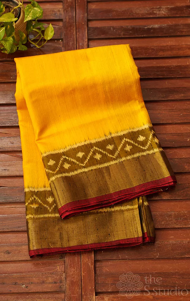 Yellow patola raw silk saree with ikat woven mehandi green border