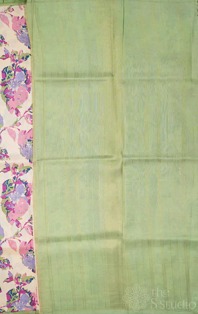 Off white kanchipuram silk saree with pastel prints and elachi green pallu