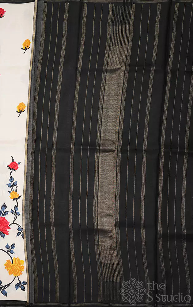 White kanchi pattu saree with floral prints and black pallu