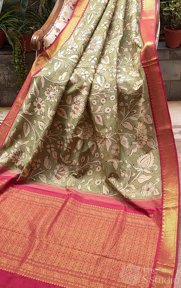 Olive green coloured kanchi hand painted kalamakari saree with korvai red border