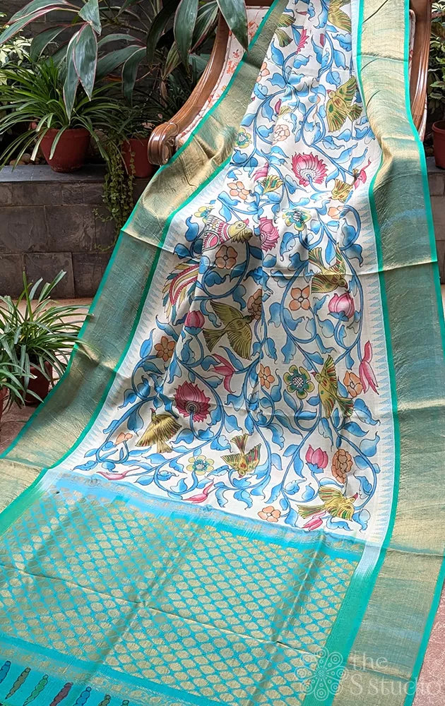White original handpainted kalamkari saree in silk cotton with blue border