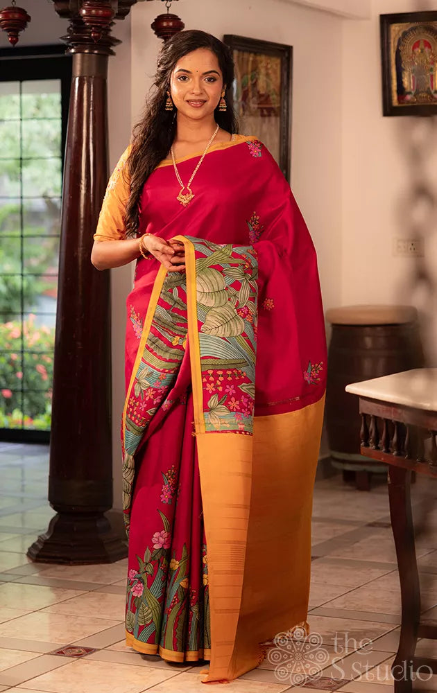 Maroon kanchi silk saree with floral prints along border