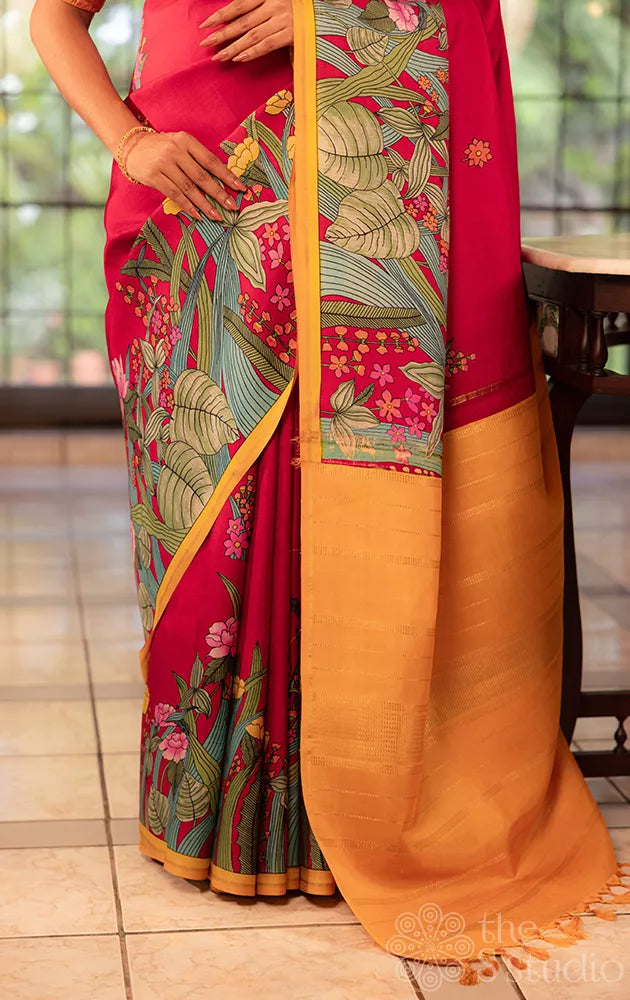 Maroon kanchi silk saree with floral prints along border