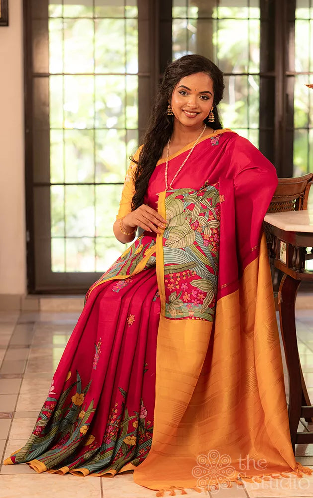 Maroon kanchi silk saree with floral prints along border