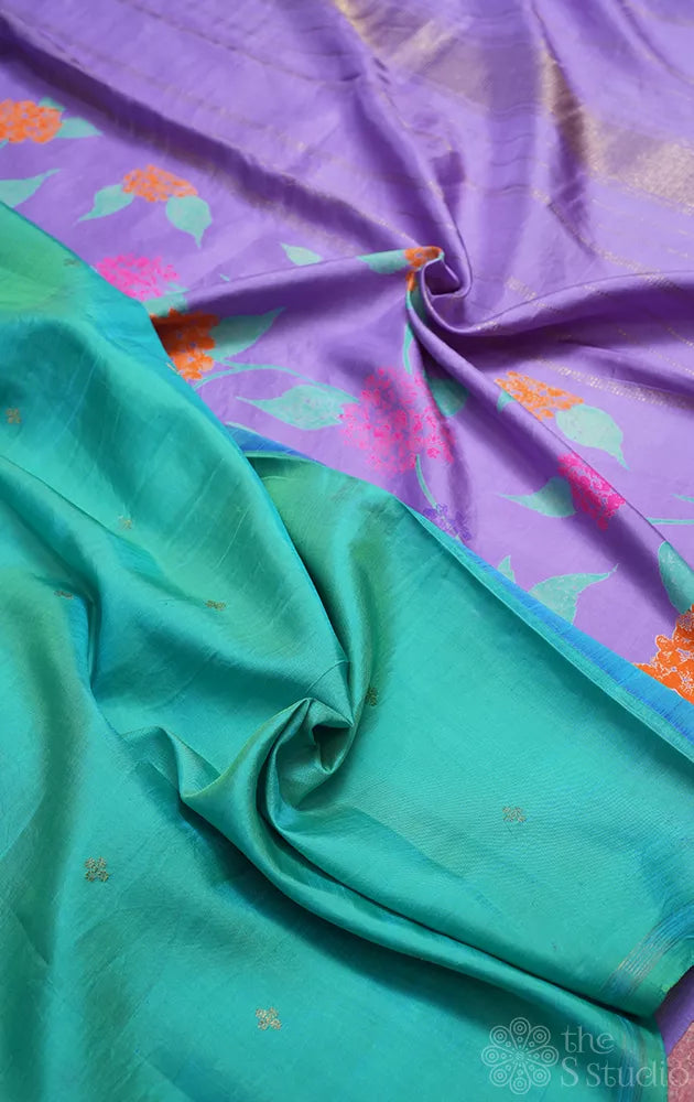 Lavendar and sea green reversible half and half kanchipuram silk saree with floral prints