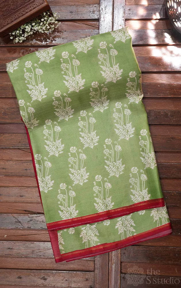 Elachi green kanchipuram silk saree with prints and a maroon pallu