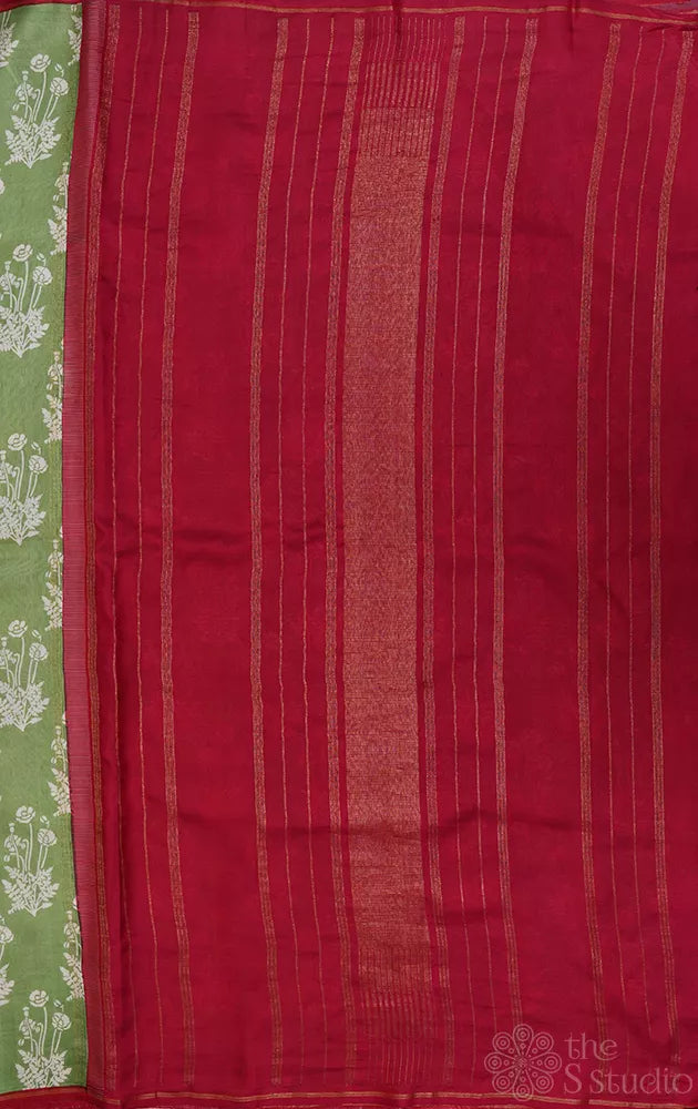 Elachi green kanchipuram silk saree with prints and a maroon pallu