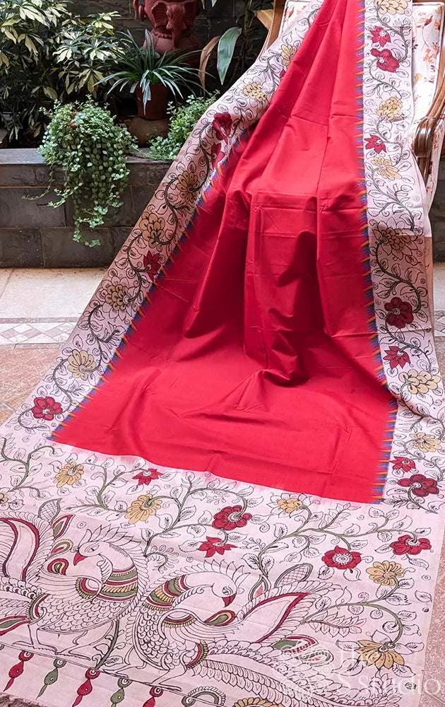 Red pochampally ikat silk saree with pen kalamkari border