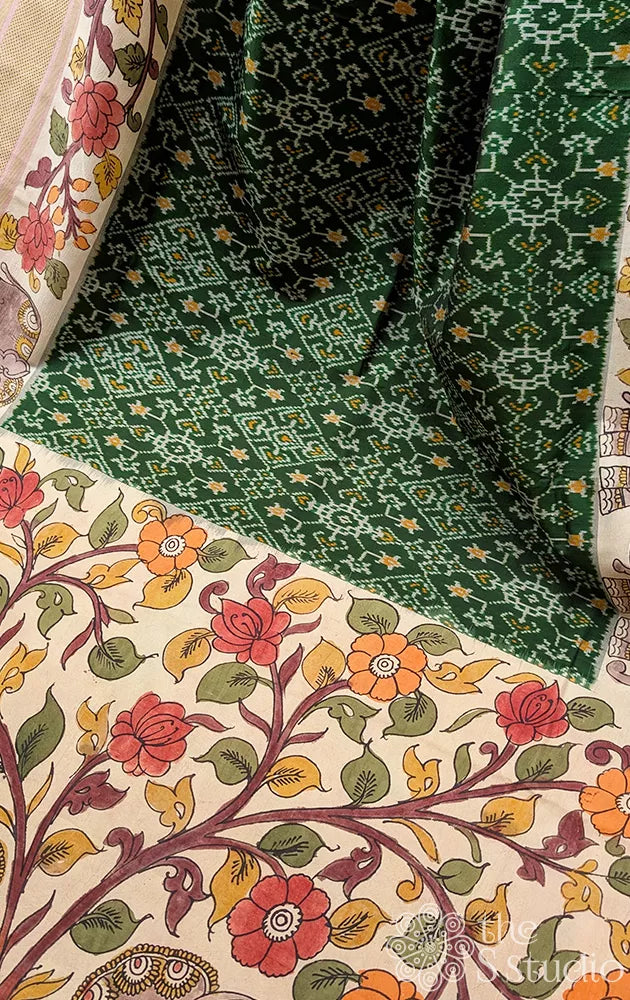 Green ikkat silk saree with hand painted kalamkari border and pallu