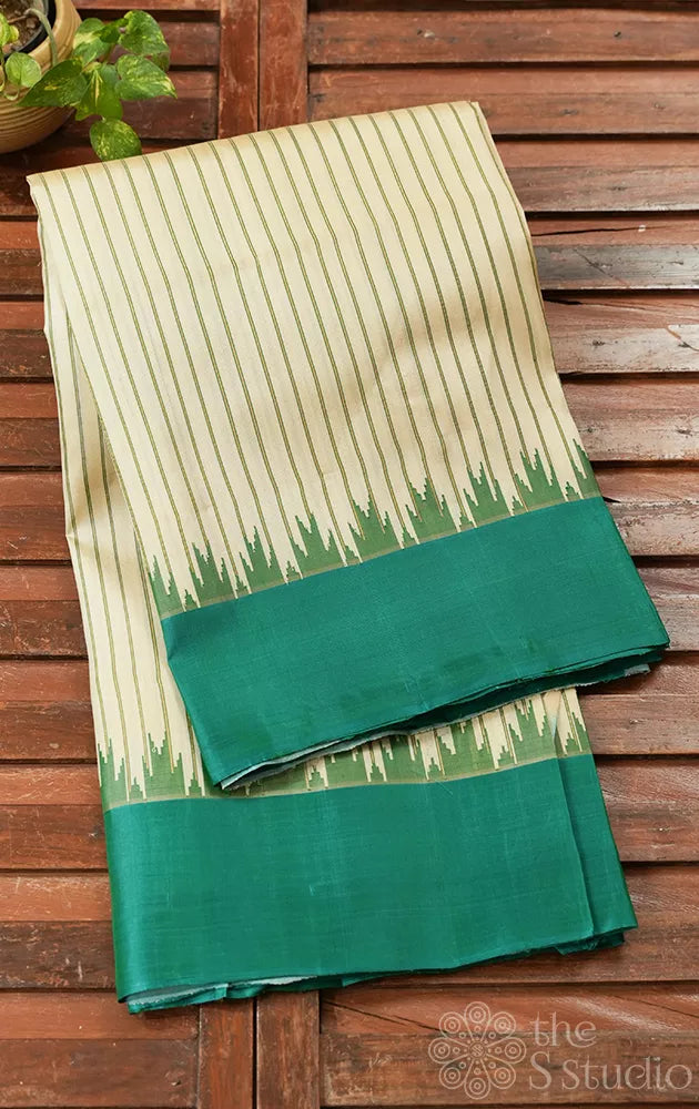 Off white gadwal silk saree with teal green temple border
